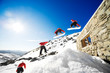 Sequence shot of snowboarder jumping off cabin roof