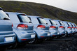 Many cars parked in a row