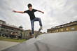 Boy practicing skate in a skate park