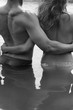 Man and woman are embracing standing in water