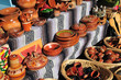 Outdoor market stall selling Mexican pottery Outdoor market stall selling Mexican pottery