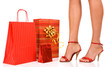Attractive legs with colorful shopping bag.