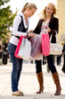 Foto: Two young girls shopping in the sunny weather Two young girls shopping in the sunny weather