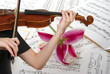 Musical notes, playing violin and lily flower
