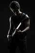 young musician playing in the darkness young musician playing in the darkness