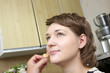 A cosmetologist applies face make-up for a girl