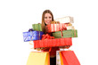 Attractive woman holding many gift boxes and bags