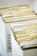 Rows of file forler filled with paperwork in an office Rows of file forler filled with paperwork in an office