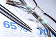 Glasses and pen macro closeup. Business Concept.