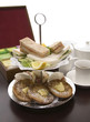 An arrangement of sandwiches and scones for afternoon tea
