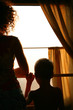 mother with sun silhouette in train
