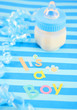 a blue baby bottle with milk and celebratory it's a boy text