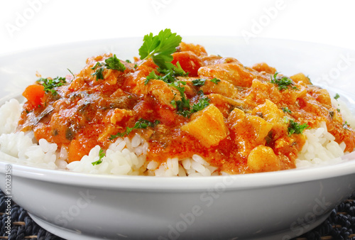 Photo: Chicken curry over steamed white rice. Chicken curry over steamed white rice.