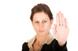 Brunette business woman holding hand up, looking annoyed