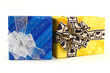 Two christmas presents with ties on white background