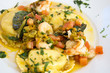Fresh pasta ravioli filled with potatoes and seafood
