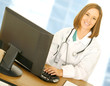 doctor woman work with computer in her modern office