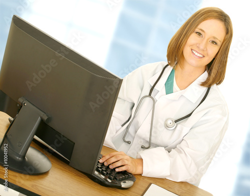 doctor woman work with computer in her modern office