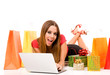 Beautiful young woman shopping over internet Beautiful young woman shopping over internet