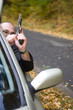 danger gangster traveling by car
