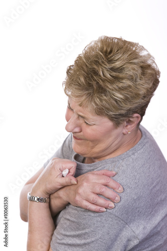 Photo: woman with shoulder pain woman with shoulder pain