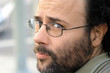 Portrait of a serious bearded man with glasses