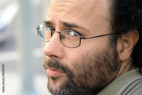 Photo: Portrait of a serious bearded man with glasses Portrait of a serious bearded man with glasses