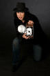 Retro style female photographer with vintage camera and flash