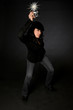 Retro style female photographer with vintage camera and flash