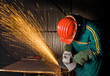 heavy industry manual worker with grinder background