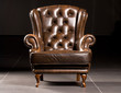 Brown leather armchair on a black background