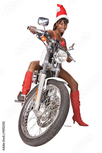 Photo: santa woman with long hair and red cap riding a bike, santa woman with long hair and red cap riding a bike,