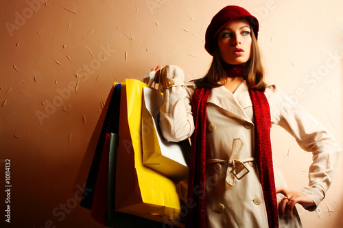 Photo: Portrait of young beautiful women with her shopping bags Portrait of young beautiful women with her shopping bags