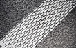 Foto: Closeup of a white painting on road - safety lines Closeup of a white painting on road - safety lines