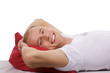 beautiful young men lay on a back on a red pillow. isolation.