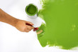 Green painting with a paint brush and paint can