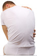 Isolated image rear view. Sitting sensible young man in white.