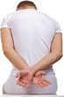 Isolated image sitting young man in white.