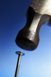 Photo: closeup of a nail being hit by a hammer closeup of a nail being hit by a hammer