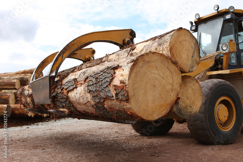 Photo: Industrial grabber truck carrying large timber logs Industrial grabber truck carrying large timber logs