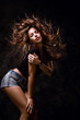 Foto : attractive young woman dancing, hair flying attractive young woman dancing, hair flying