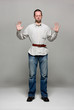 Young man with a belt tightened to the extreme