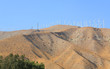 Blue Sky Smoke Free behind Electric Wind Mill Turbines