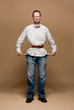 Young man with a belt tightened to the extreme