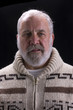 bearded man in sweater modeling in Hemingway fashion