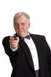 older businessman in a suit  isolated on white with a gun