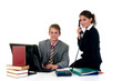 Businessman on computer with assistant making phone call