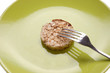 Strict diet. Green plate with cereal pastry