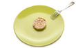 Green plate with cereal dietary pastry and fork