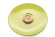 Strict diet. Green plate with cereal pastry